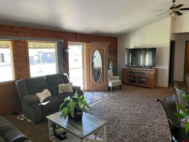 a dining room with furniture and window