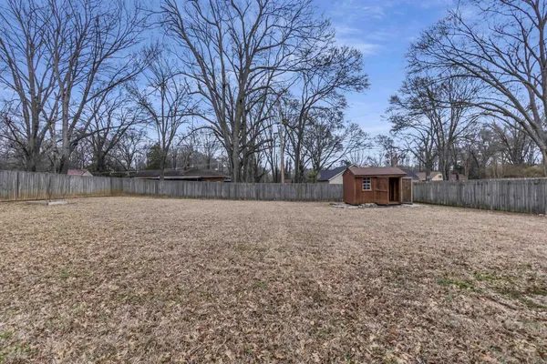 a backyard of a house with lots of green space