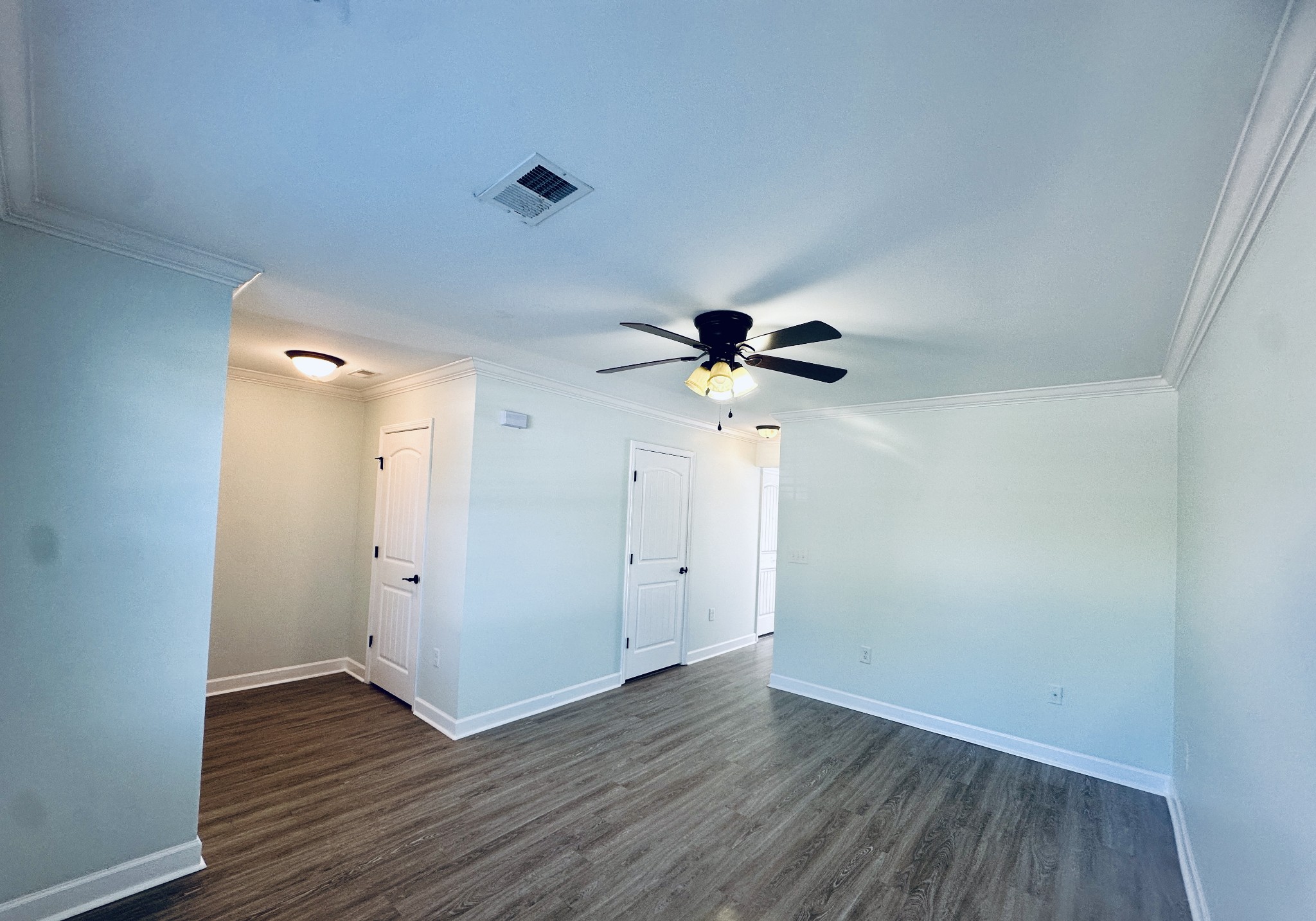 935 Bluebird Road Lebanon, TN 37087 - Photo 3 of 11 a view of an empty room with wooden floor and a ceiling fan