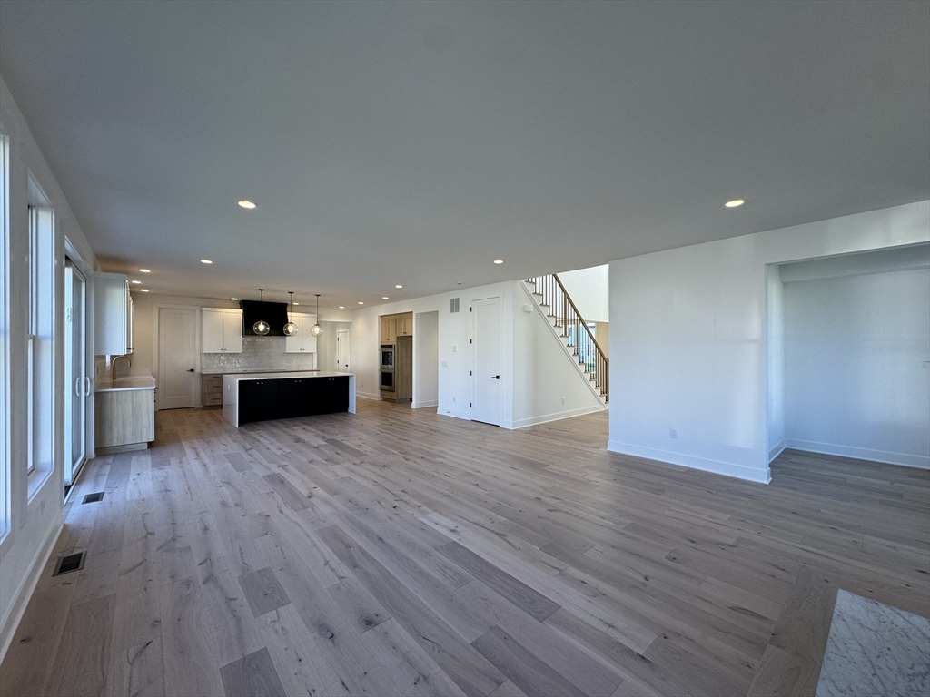 12 Old County Road, Unit 20 Hudson, MA 01749 - Photo 23 of 30 a view of kitchen and hall with wooden floor