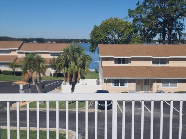 a view of a balcony with wooden floor