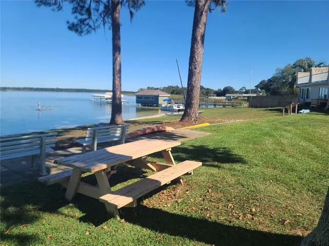 a view of a water pond with lots of green space
