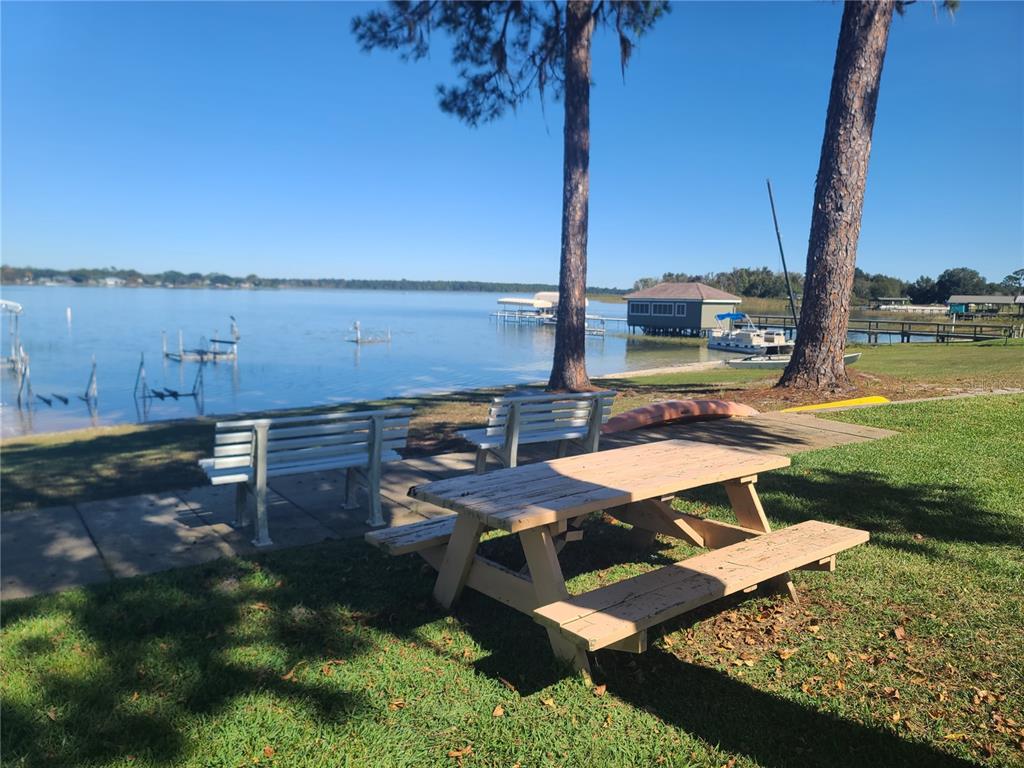 11001 Southeast Sunset Harbor Road, Unit C27 Summerfield, FL 34491 - Photo 40 of 53 a view of a ocean with a yard