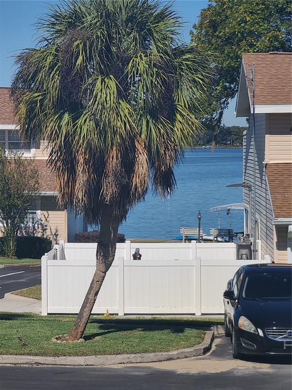 11001 Southeast Sunset Harbor Road, Unit C27 Summerfield, FL 34491 - Photo 4 of 53 a view of a house with a yard