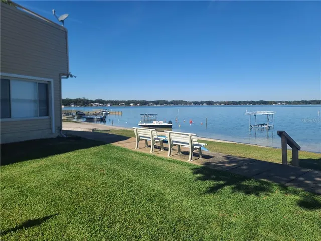 a view of a backyard with sitting area