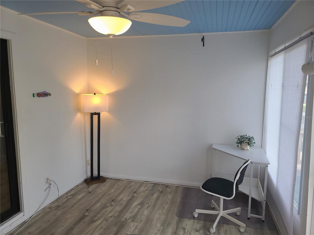 11001 Southeast Sunset Harbor Road, Unit C27 Summerfield, FL 34491 - Photo 5 of 53 a view of a room with a table and chairs