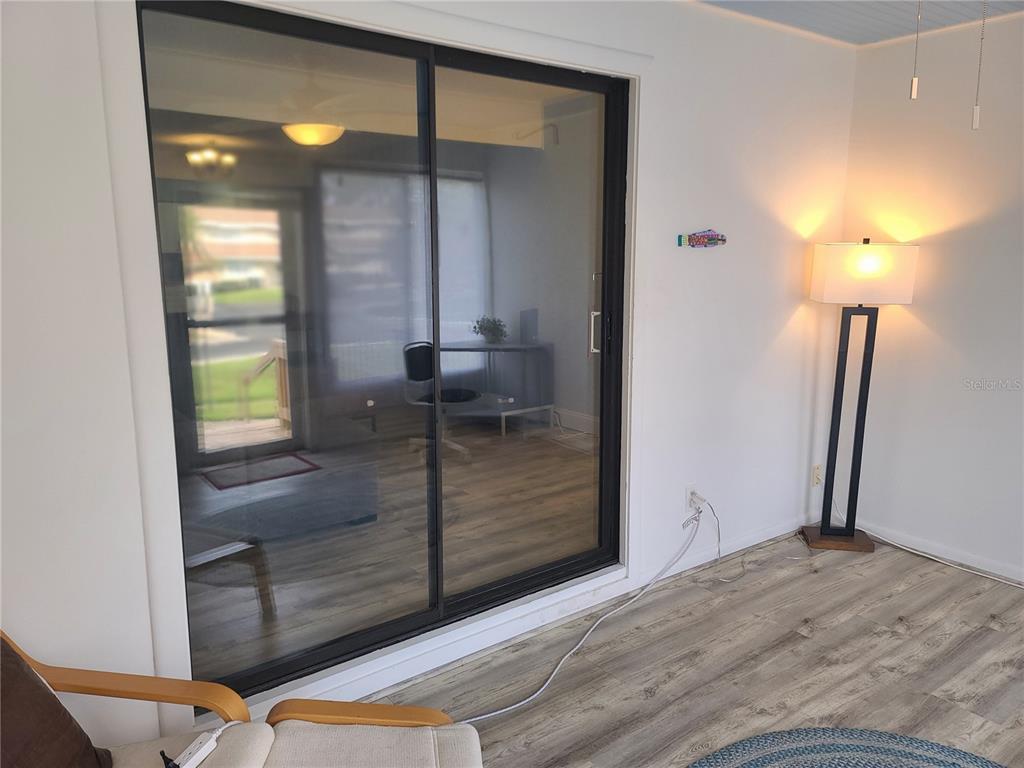 11001 Southeast Sunset Harbor Road, Unit C27 Summerfield, FL 34491 - Photo 6 of 53 a view of an entryway door