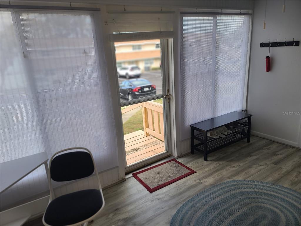 11001 Southeast Sunset Harbor Road, Unit C27 Summerfield, FL 34491 - Photo 7 of 53 a living room with furniture and a window