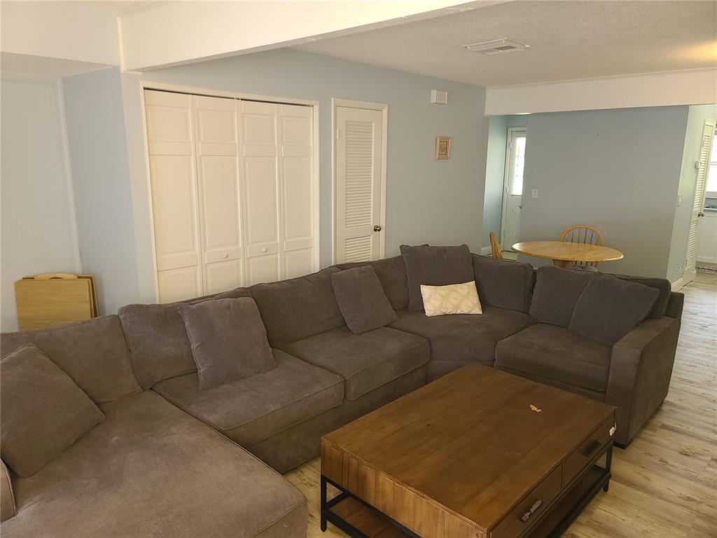 11001 Southeast Sunset Harbor Road, Unit C27 Summerfield, FL 34491 - Photo 10 of 53 a living room with furniture and a window