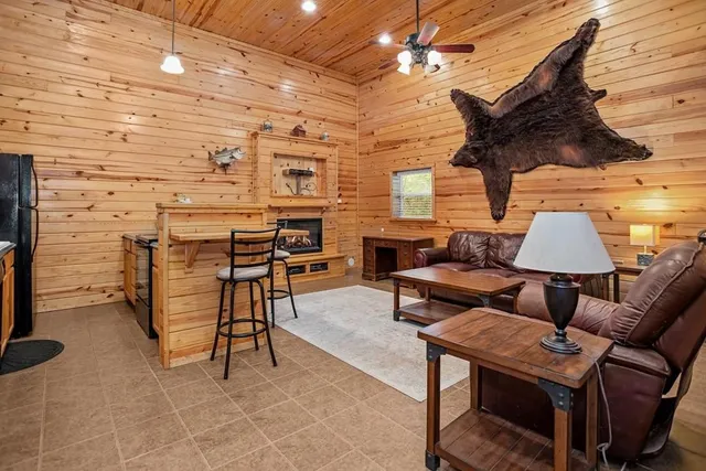 a reading room with furniture and a lamp