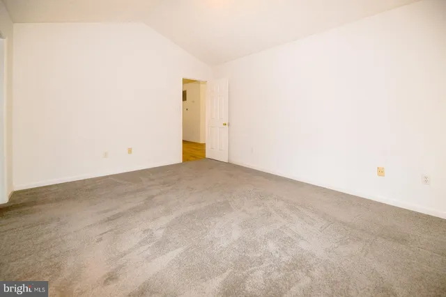 a view of a big room with closet and wooden floor