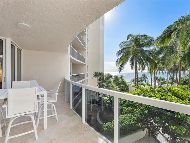 a view of a balcony with chairs