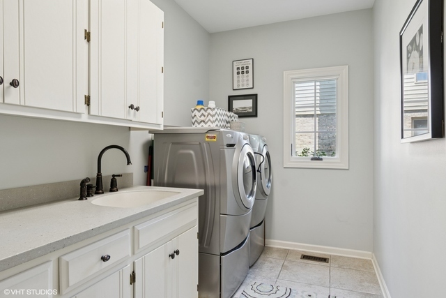 8S241 Dunham Drive Naperville, IL 60540 - Photo 11 of 27 a bathroom with a sink and a mirror