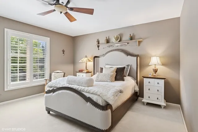 a spacious bedroom with a bed and a window