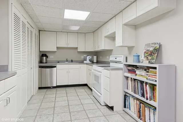 a kitchen with cabinets a sink and appliances