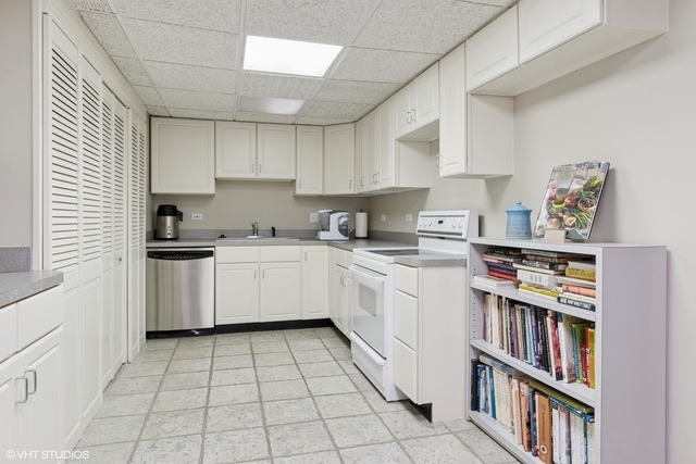 8S241 Dunham Drive Naperville, IL 60540 - Photo 20 of 27 a kitchen with cabinets a sink and appliances