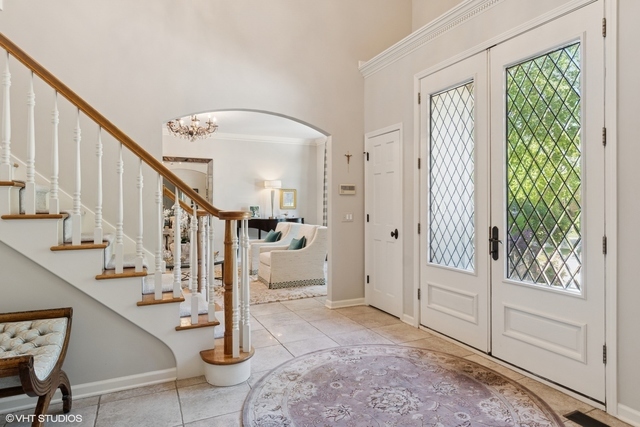 8S241 Dunham Drive Naperville, IL 60540 - Photo 2 of 27 a view of entryway and hall with wooden floor