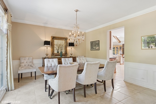 8S241 Dunham Drive Naperville, IL 60540 - Photo 4 of 27 a view of a dining room with furniture and chandelier