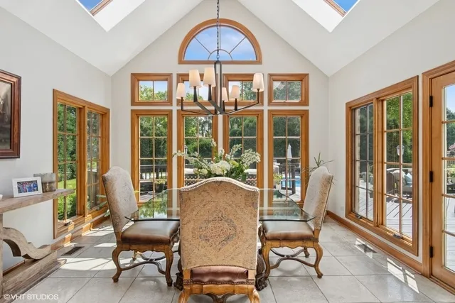 a living room filled with furniture and a window