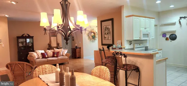 a living room with furniture and a large mirror