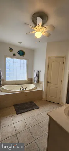 a kitchen with a stove a sink and a refrigerator