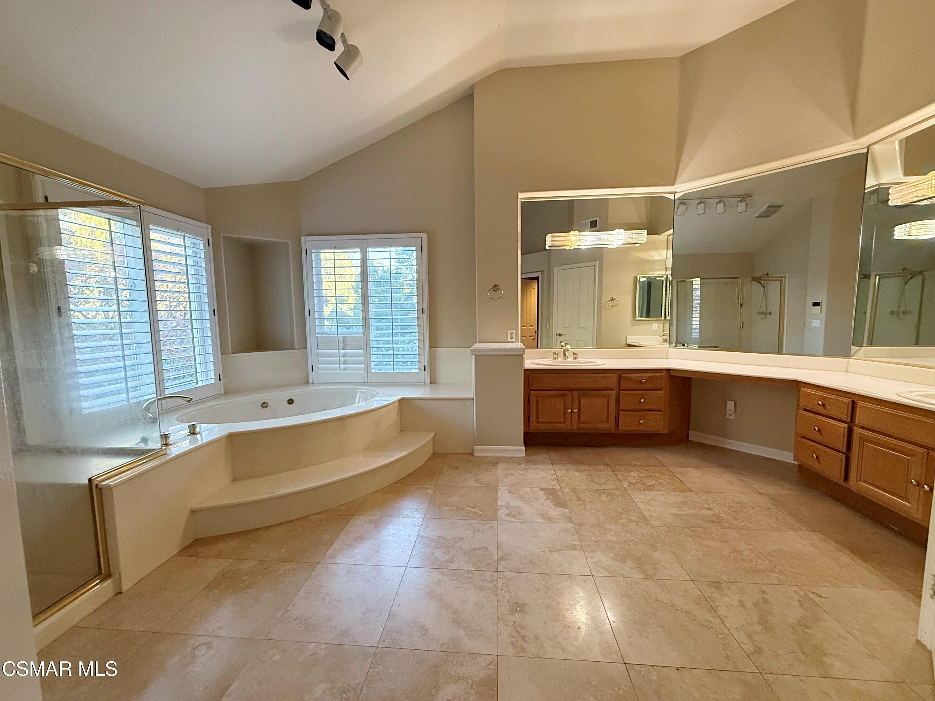 267 High Meadow Street Simi Valley, CA 93065 - Photo 22 of 36 a large bathroom with a large tub and sink