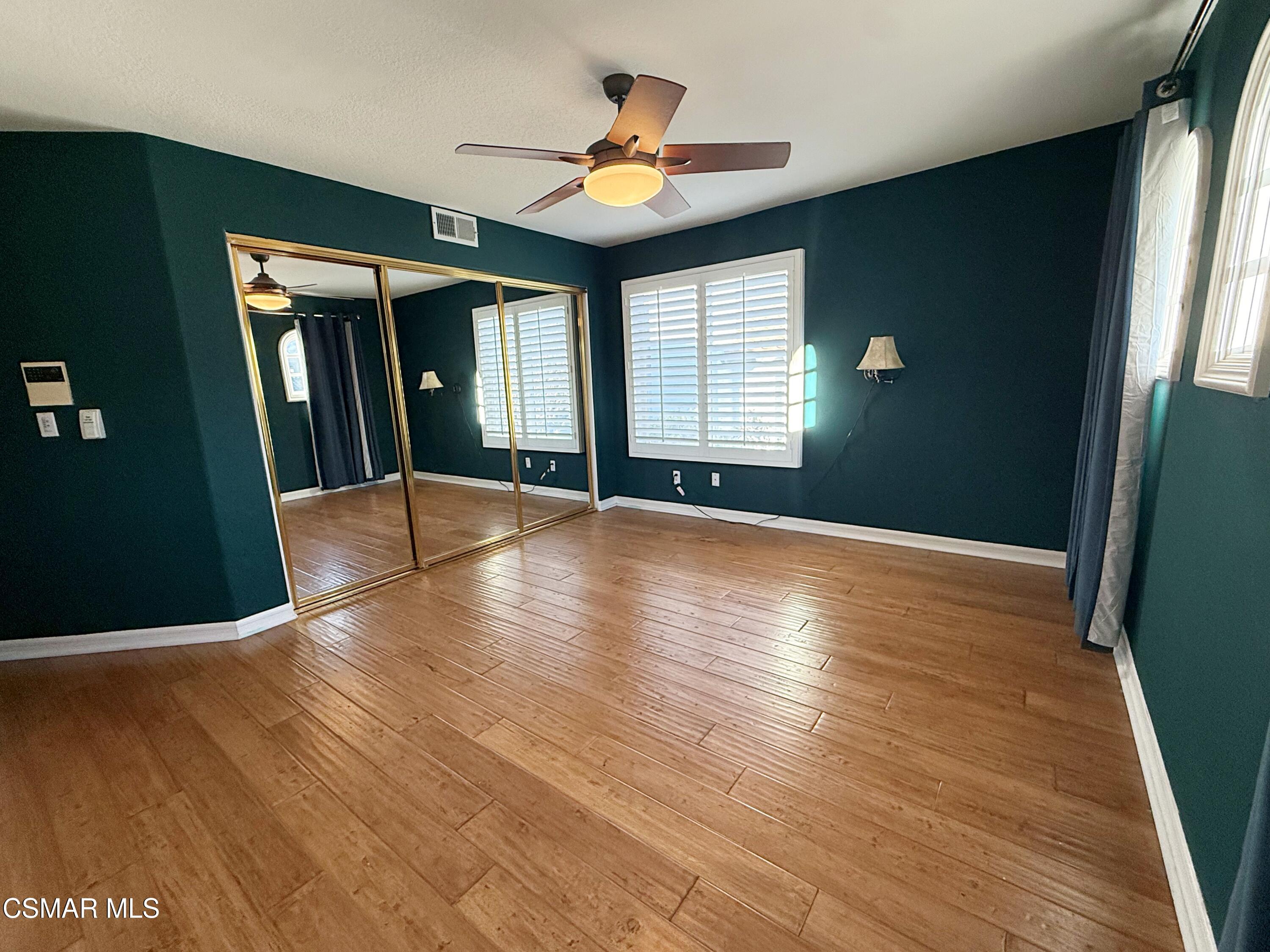 267 High Meadow Street Simi Valley, CA 93065 - Photo 26 of 36 a view of an empty room with window and wooden floor