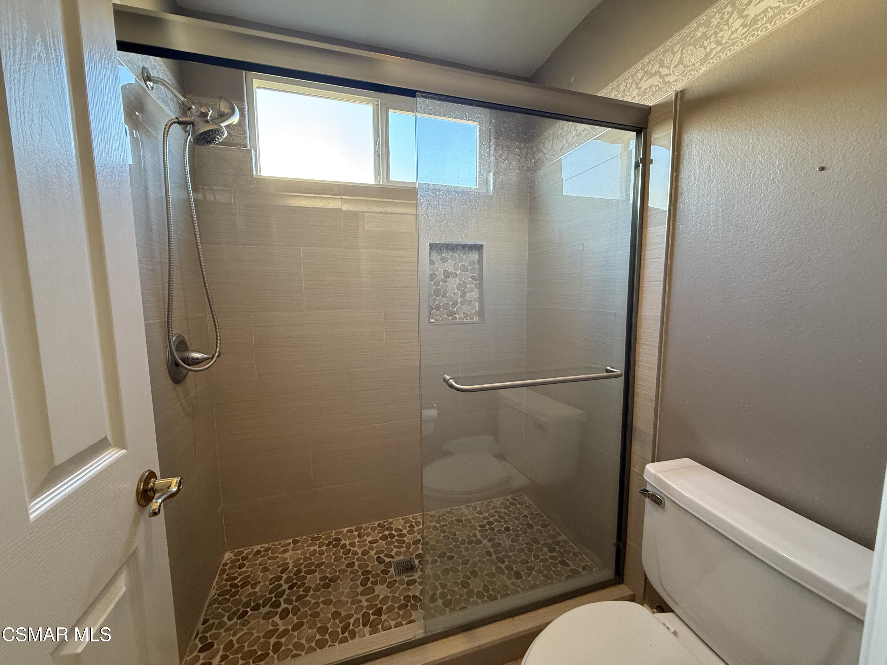 267 High Meadow Street Simi Valley, CA 93065 - Photo 28 of 36 a bathroom with a granite countertop toilet and a shower