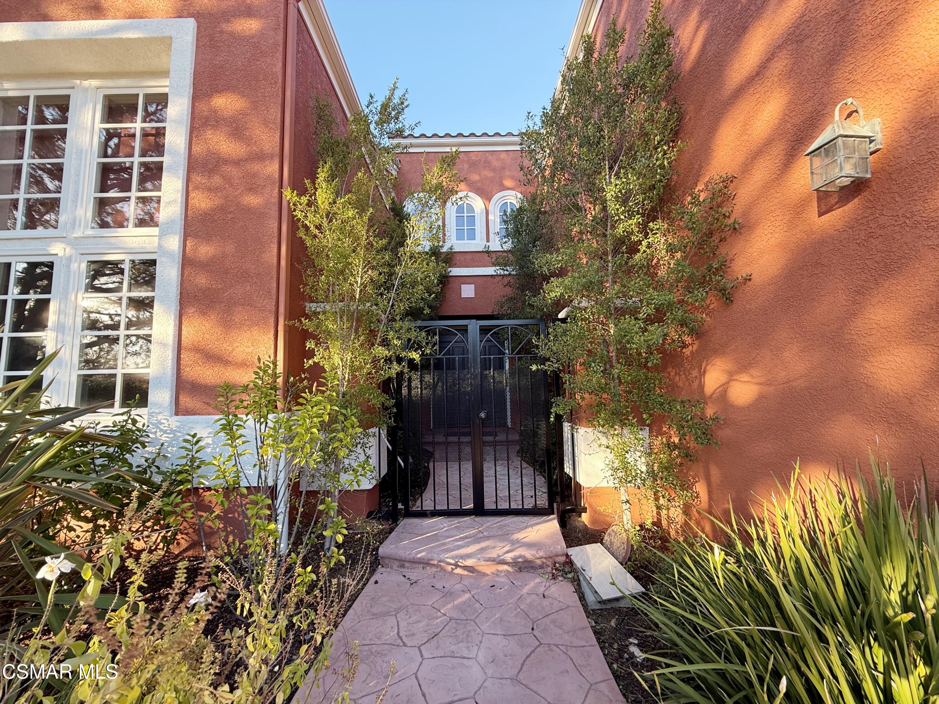267 High Meadow Street Simi Valley, CA 93065 - Photo 3 of 36 a front view of a house with a yard