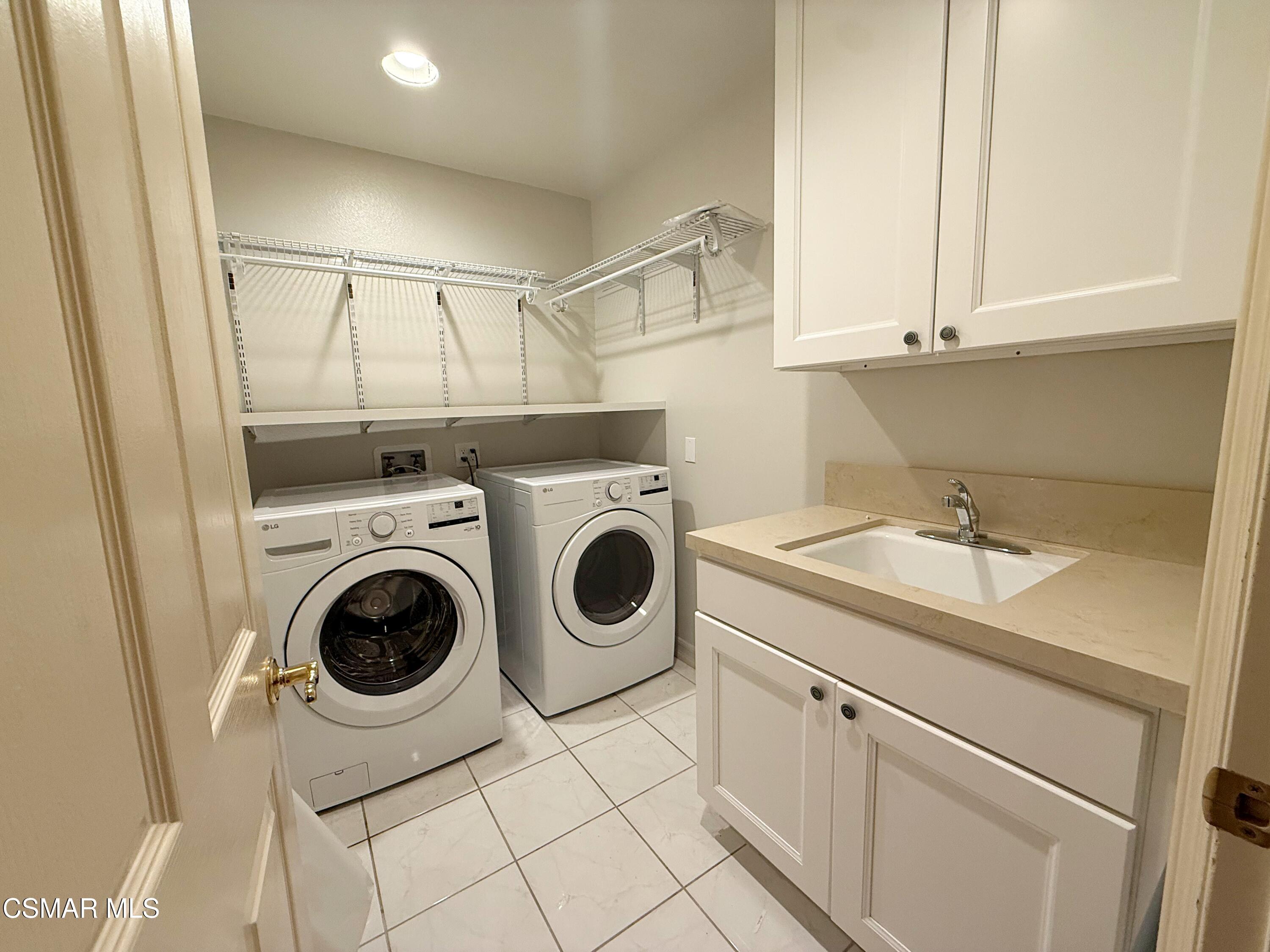267 High Meadow Street Simi Valley, CA 93065 - Photo 32 of 36 a utility room with dryer and washer