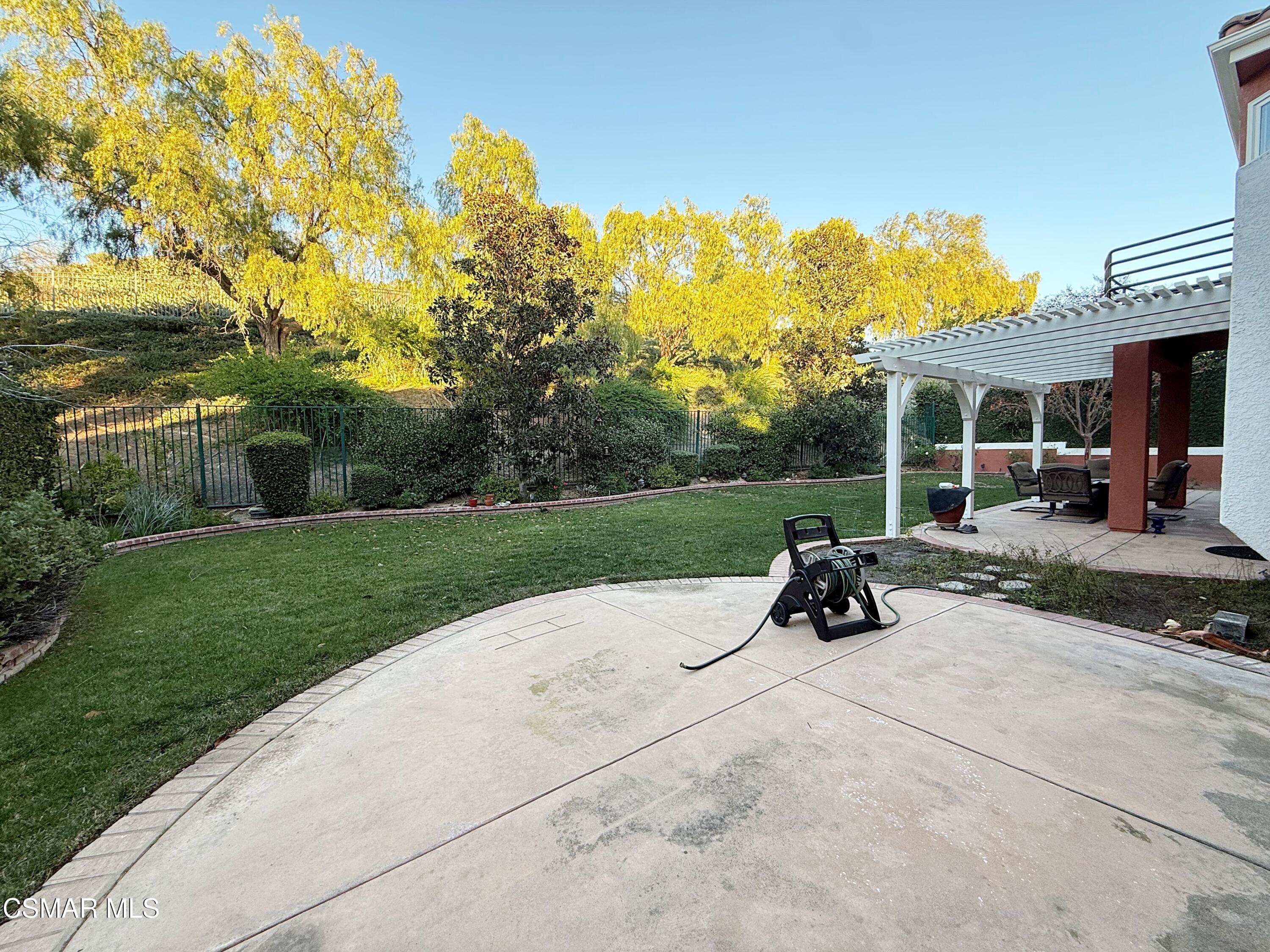 267 High Meadow Street Simi Valley, CA 93065 - Photo 34 of 36 a view of a park with plants and a bench