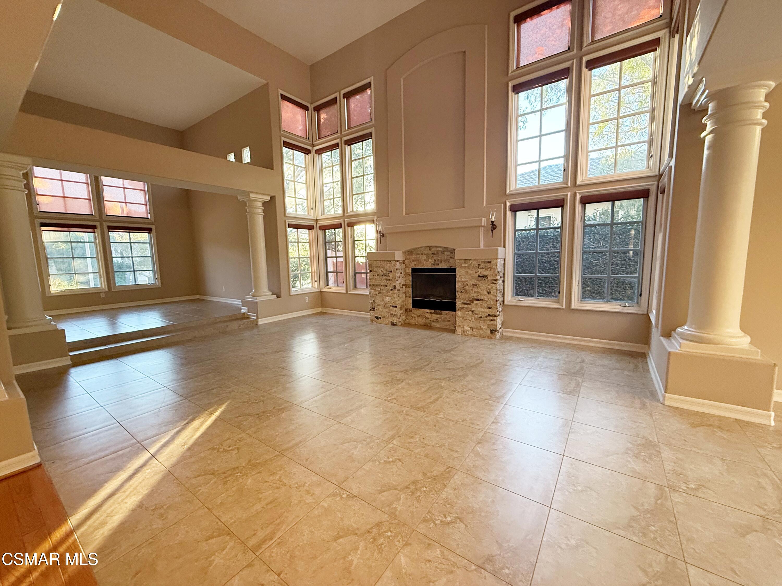 267 High Meadow Street Simi Valley, CA 93065 - Photo 6 of 36 a view of an empty room with a fireplace and a window