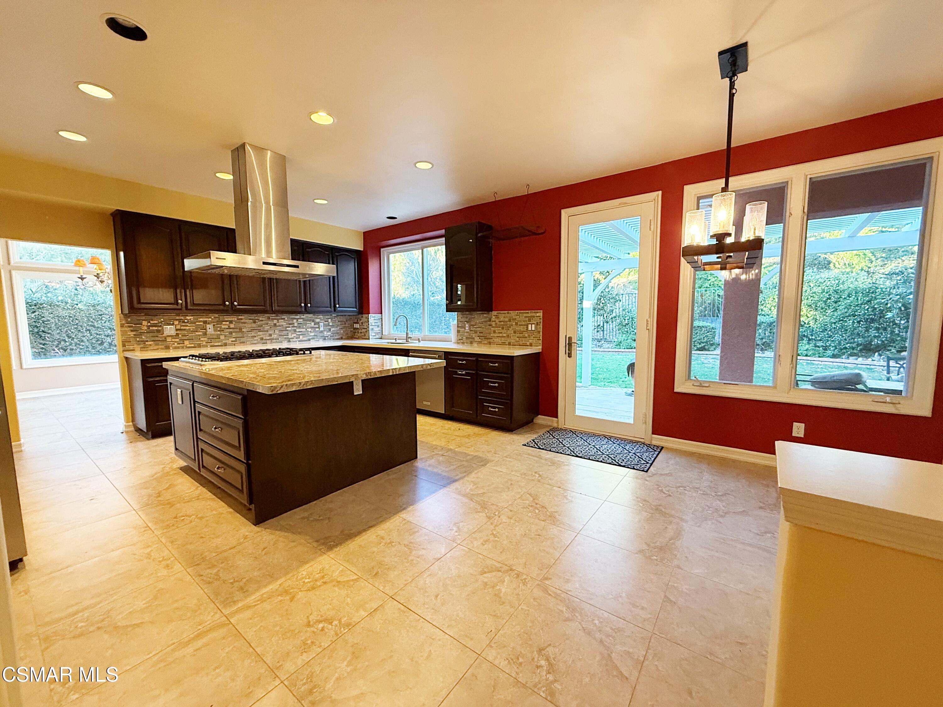 267 High Meadow Street Simi Valley, CA 93065 - Photo 9 of 36 a kitchen with stainless steel appliances granite countertop a stove and a sink