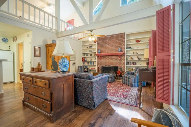 a living room with furniture and a fireplace