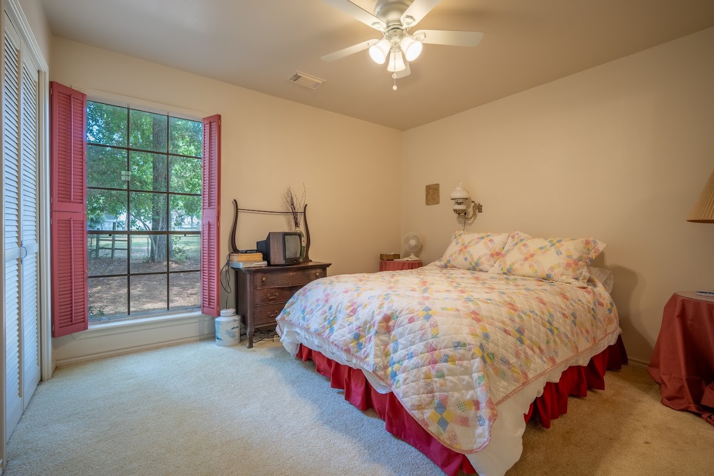 565 Timber Bay Drive Trinity, TX 75862 - Photo 22 of 49 a bed sitting in a spacious bedroom next to a window