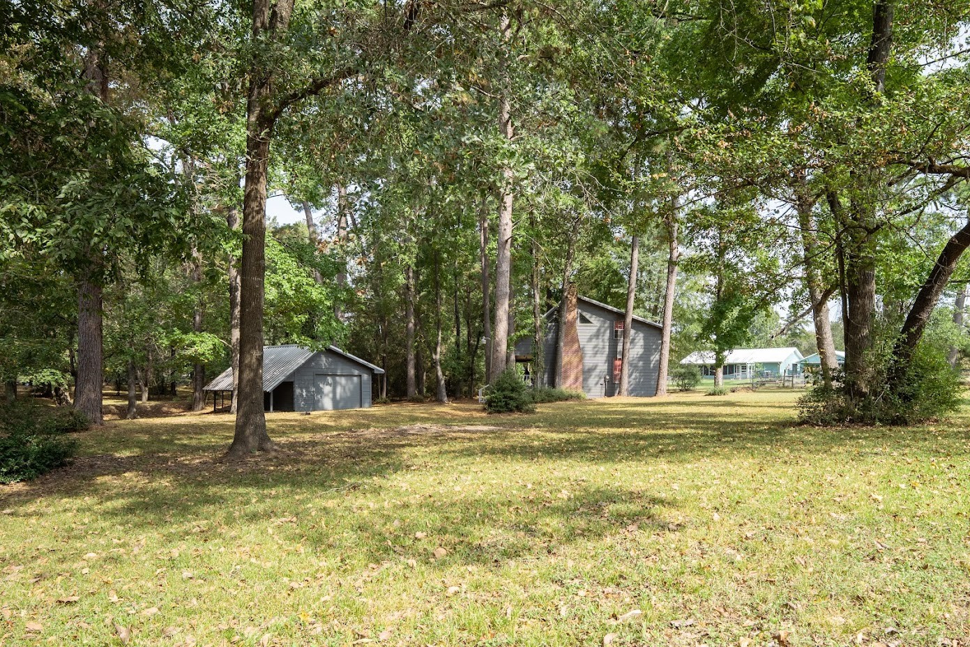 565 Timber Bay Drive Trinity, TX 75862 - Photo 39 of 49 a swimming pool with trees in the background