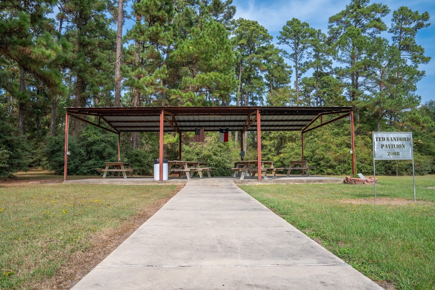 565 Timber Bay Drive Trinity, TX 75862 - Photo 48 of 49 a view of a yard with plants and wooden fence