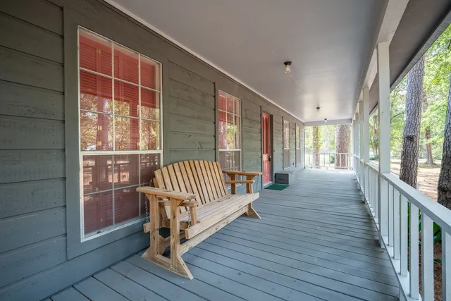 a view of a balcony with wooden floor