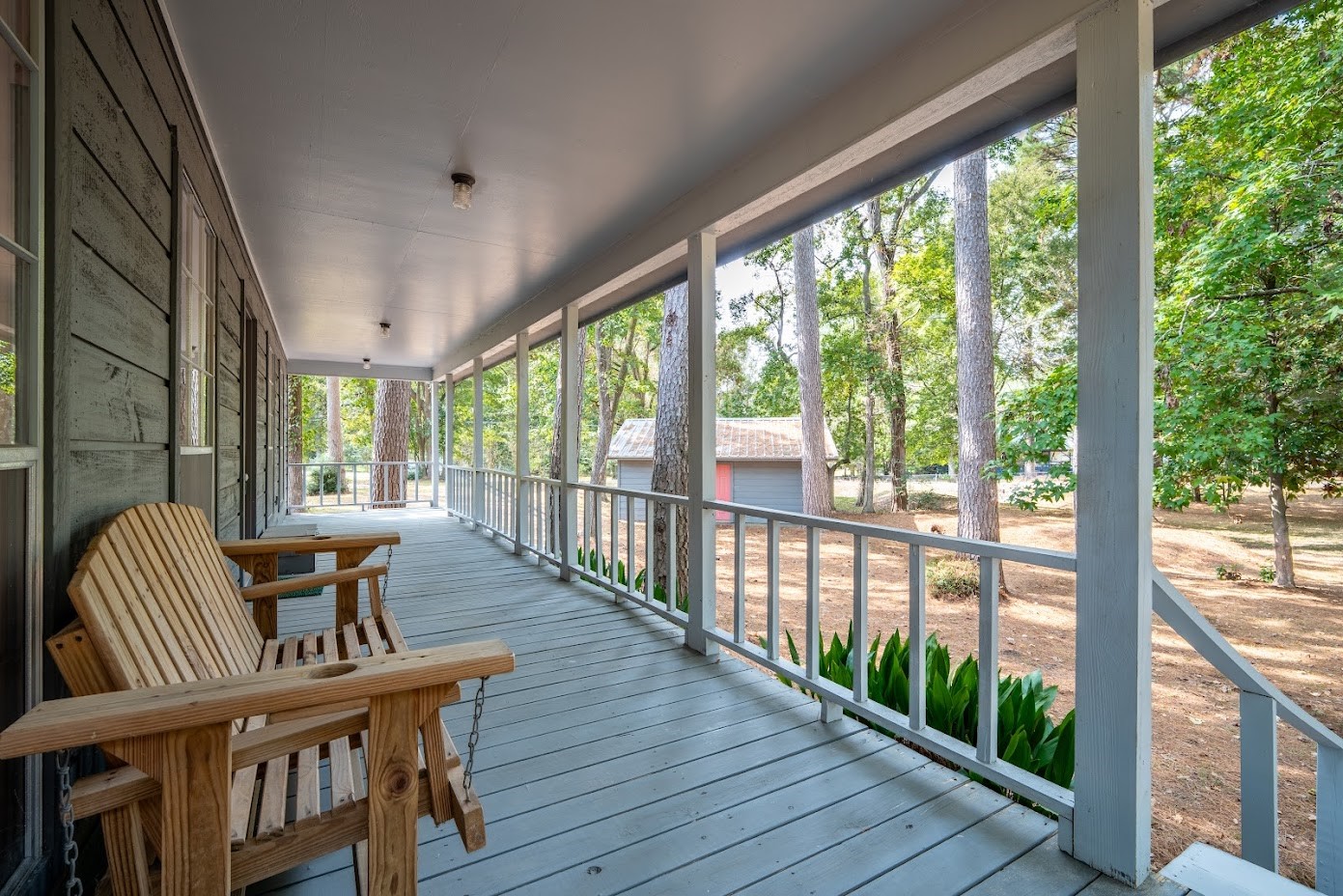 565 Timber Bay Drive Trinity, TX 75862 - Photo 7 of 49 a view of a porch with furniture and wooden floor