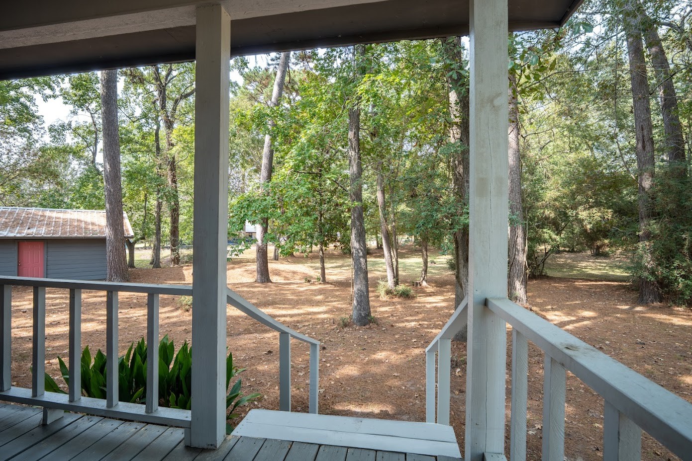565 Timber Bay Drive Trinity, TX 75862 - Photo 9 of 49 a view of a wooden deck next to a yard