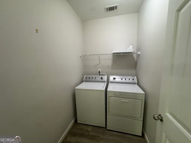 a white toilet sitting next to a bath tub