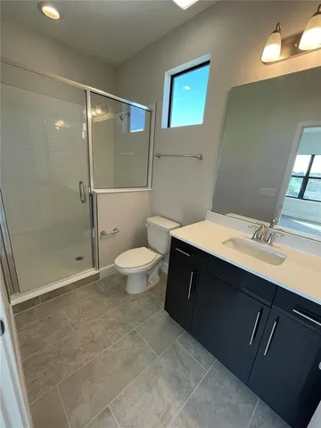 a view of a park with swings and slides