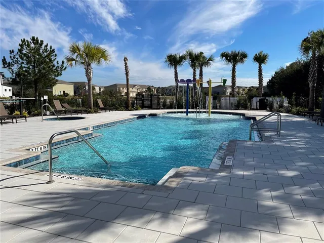 a view of a house with a yard and plant