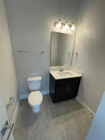 a view of living room with furniture and a flat screen tv