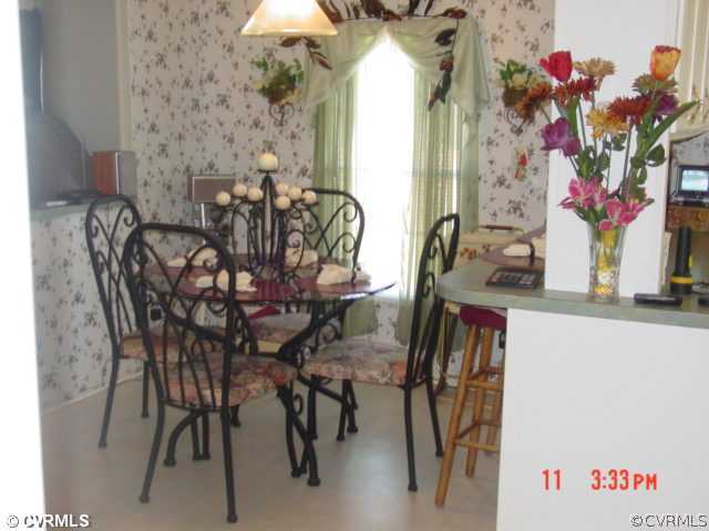 4601 Namozine Road Ford, VA 23850 - Photo 2 of 12 a view of a dining room with furniture and a potted plant