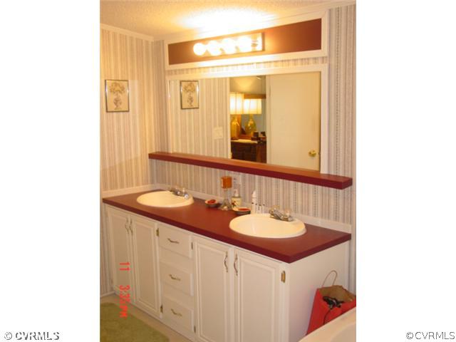 4601 Namozine Road Ford, VA 23850 - Photo 5 of 12 a bathroom with a sink and a mirror