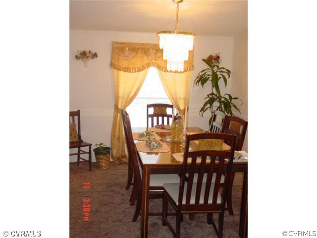 4601 Namozine Road Ford, VA 23850 - Photo 7 of 12 a view of a dining room with furniture and a chandelier