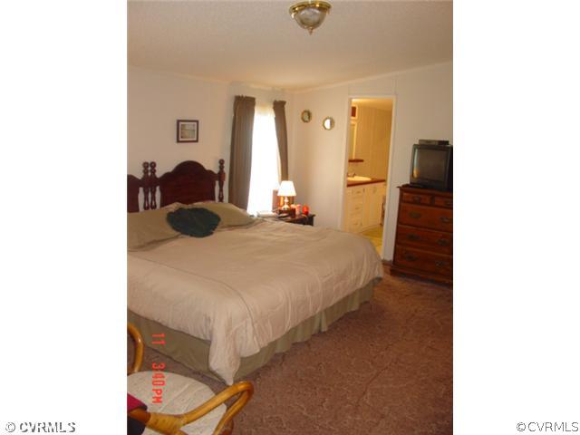 4601 Namozine Road Ford, VA 23850 - Photo 10 of 12 a bed room with a bed and a closet