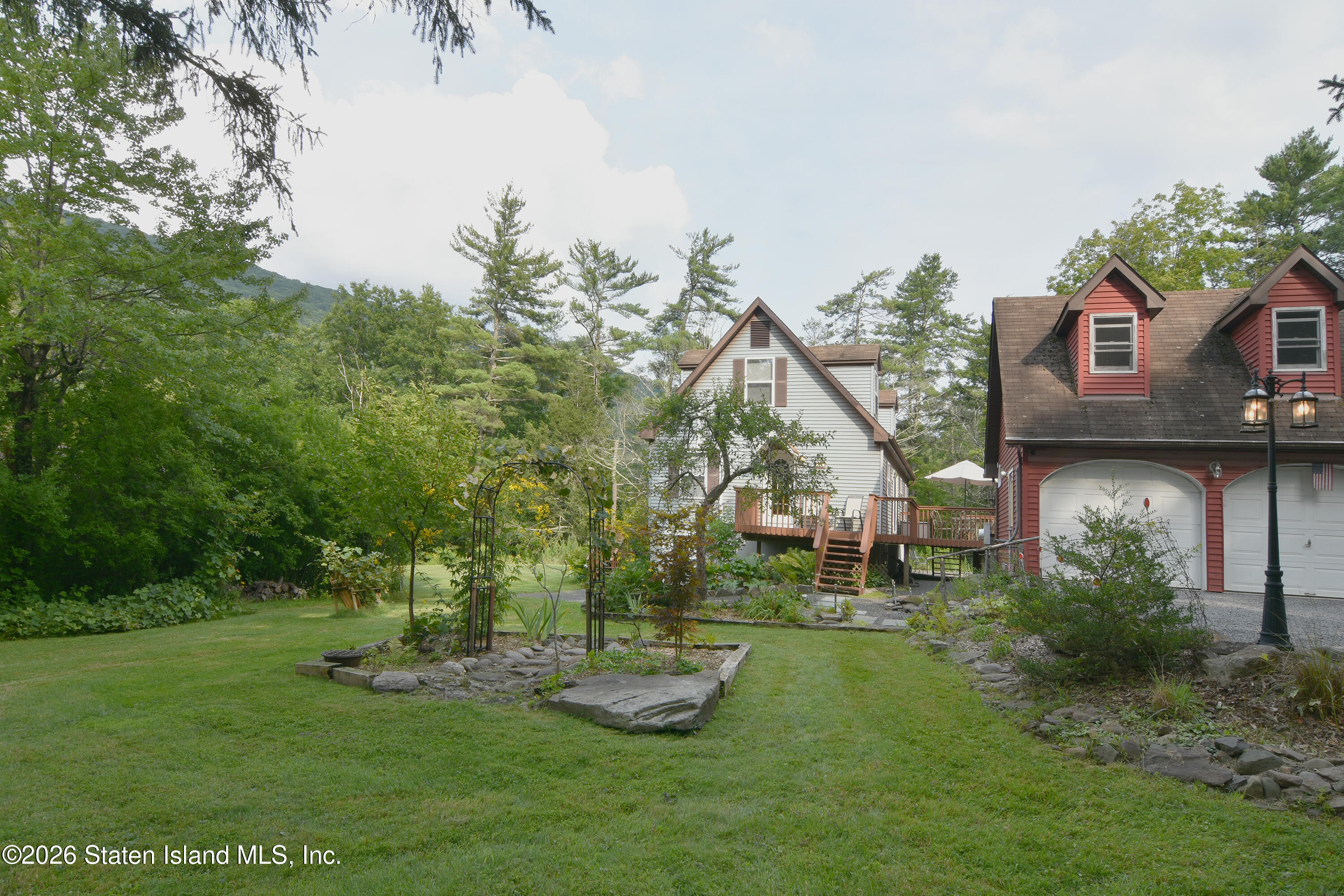 68 Garfield Road Phoenicia, NY 12464 - Photo 4 of 36 1 House and garage from Garfield lawn