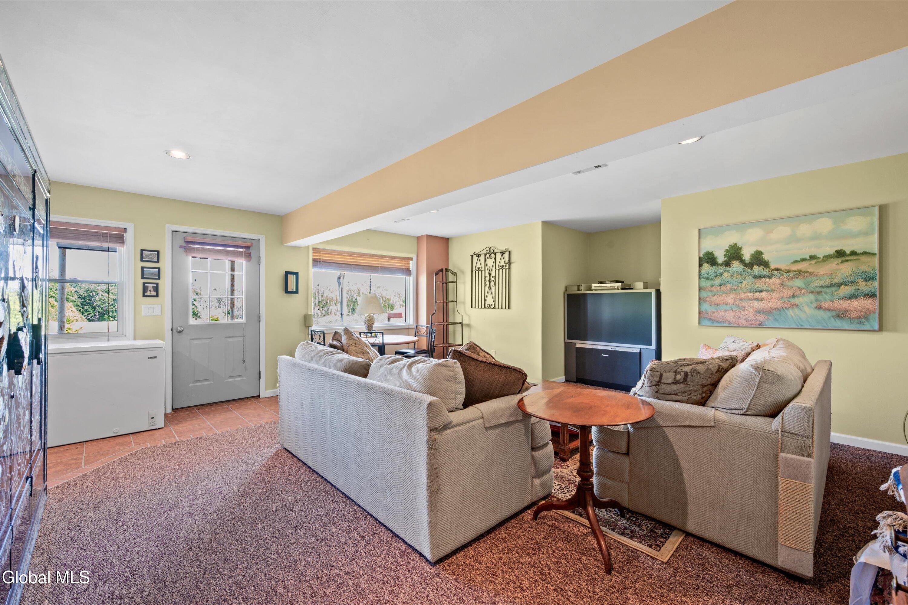 85 Harris Road Northumberland, NY 12871 - Photo 32 of 46 Lower-level living room